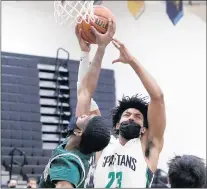  ?? JOHN SMIERCIAK / DAILY SOUTHTOWN ?? Oak Lawn’s Rafael Bou (23) fights for a rebound against Evergreen Park’s Jalen Shepherd during a game on Friday.