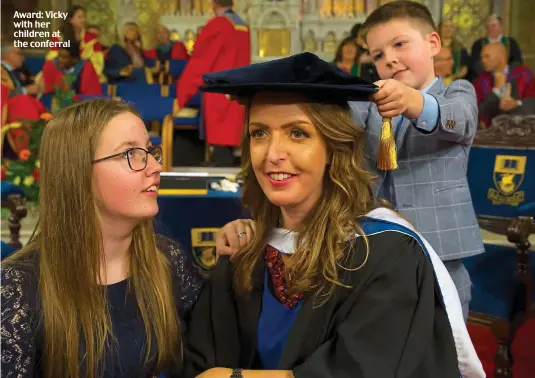  ??  ?? Award: Vicky with her children at the conferral