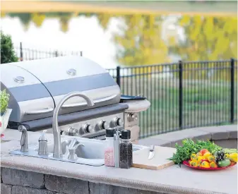  ?? DREAMSTIME ?? Pros say kitchens are popular outdoor additions for 2022.