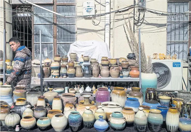  ??  ?? en. Young people are moving to the southern river city to learn the art of handcrafti­ng fine porcelain, reviving an ancient artisan tradition and hoping to profit by filling a demand born of the middle-class boom.