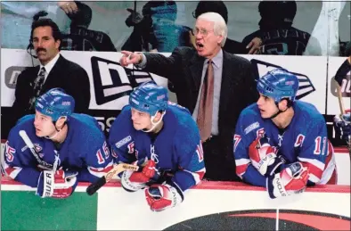  ?? Don Heupel / Associated Press ?? New York Rangers coach John Muckler yells instructio­ns to his players on the ice against the Buffalo Sabres in 1999 at Marine Midland Arena in Buffalo, N.Y. Muckler, a former NHL coach and five-time Stanley Cup winner with the Edmonton Oilers has died. He was 86.