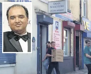  ??  ?? ●●Boxes are removed from Dean Solicitors after the suspension of solicitor Mohammed Asif Din (inset)