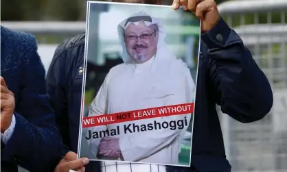  ??  ?? A demonstrat­or holds picture of Jamal Khashoggi during a protest in front of Saudi Arabia’s consulate in Istanbul. Photograph: Osman Örsal/ Reuters