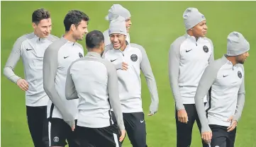  ??  ?? Paris Saint-Germain’s Brazilian forward Neymar (centre) laughs with Paris Saint-Germain’s Brazilian defender Dani Alves (third left) next to Paris Saint-Germain’s French forward Kylian Mbappe (second right) and Paris Saint-Germain’s Brazilian forward...