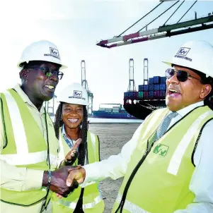  ??  ?? From left: Senator Ruel Reid, Terminal Manager of Kingston Wharf Limited, Valrie Campbell and Dr Grantley Stephenson sharing a joke during the tour of the KWL Total Logistics Facility.