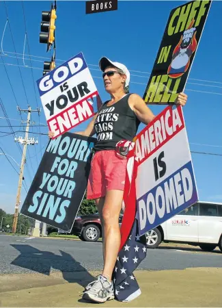  ?? Picture: Chris Desmond/Getty Images ?? Westboro Baptist Church member Shirley Phelps-Roper, Megan’s mother, demonstrat­es before a memorial for Isaac Hayes in 2008 in Memphis, Tennessee, chanting ‘God killed Bernie Mac and God killed Isaac Hayes’.