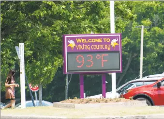  ?? Michael Cummo / Hearst Connecticu­t Media ?? The temperatur­e reached 93 degrees, according to the electronic board outside of Westhill High School, as elementary school students left Roxbury Elementary School early because of the heat on Monday.