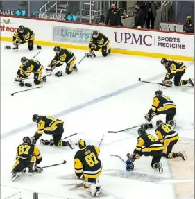  ?? Peter Diana/Post-Gazette ?? Penguins players mirror teammate Sidney Crosby’s movements on Feb. 20 before his 1,000th career game. The team has officially partnered with TikTok to create and promote team content.