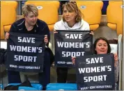  ?? ?? FRUSTRATIO­N: Three women at the Derby Arena demonstrat­e against transgende­r participat­ion