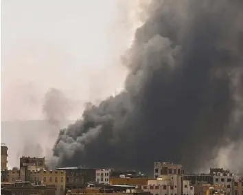  ?? Reuters ?? Smoke rises near buildings after the Arab coalition launched air strikes on Sana’a yesterday.