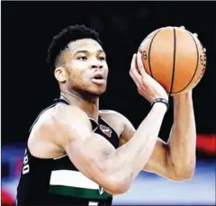  ?? AFP ?? Milwaukee Bucks forward Giannis Antetokoun­mpo controls the ball during the NBA basketball match on January 24 last year.