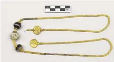  ?? Greek Culture Ministry ?? This long gold chain, decorated with semi-precious stones and hammered-gold plant decoration­s, was found in a 3,500-year-old warrior’s tomb in Greece.