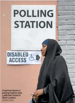  ?? (SIPANY/SIPA) ?? A woman leaves a polling station near Ladbroke Grove in West London.
