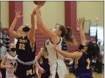  ?? AUSTIN HERTZOG - MEDIANEWS GROUP ?? Pottsgrove’s Rachel Ludwig, center, shoots from close range as Mount St. Joseph’s Grace Niekelski (22) defends in a District 1-5A playoff game Saturday.