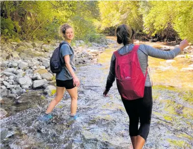  ?? Photo / Tessa Willis ?? Enjoying the river crossings at the end of the Kapakapanu­i Track.