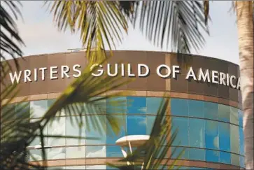  ?? Al Seib Los Angeles Times ?? THE WRITERS GUILD of America agreed to a one-week delay in implementi­ng a proposed franchise agreement that would have ended long-standing industry practices, allowing more time to negotiate a settlement.