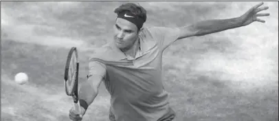  ?? The Associated Press ?? RECLAMATIO­N PROJECT: Roger Federer returns the ball to Nick Kyrgios in their semifinal match Saturday in the ATP Mercedes Cup in Stuttgart, Germany.