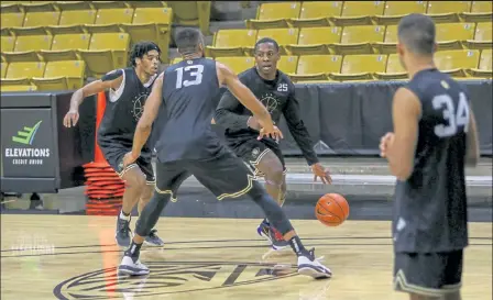  ?? Courtesy photo / Colorado Sports Informatio­n ?? Colorado guard Mckinley Wright IV tries to get to the basket during the Buffs’ first practice of the season Wednesday.