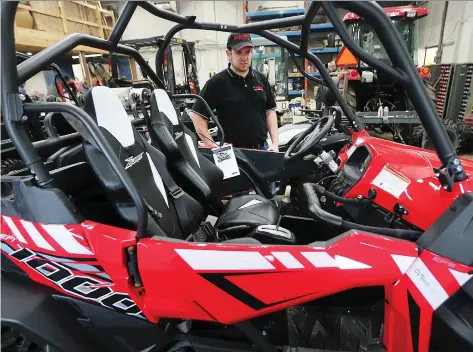  ?? DAN JANISSE ?? Steve Oliveira of Oliveira Equipment in Comber, shows a ATV that thieves tried to steal and damaged during a recent break-in. The thieves managed to get away with an ATV and two side-by-sides. The stolen property combined with the damage to two vehicles is worth about $80,000.