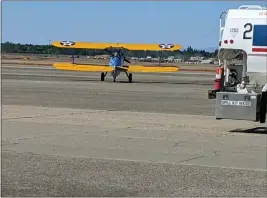  ?? ?? A Boeing Stearman biplane piloted by Andrew Lohmar moves onto the runway Wednesday at the Chico Municipal Airport with Vietnam veteran Danny Flowers as a passenger in Chico.