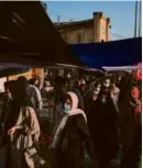  ?? ARASH KHAMOOSHI/NEW YORK TIMES ?? Women wore head coverings at a bazaar in Tehran in June, before a nationwide protest began.