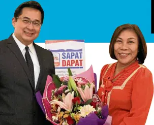  ??  ?? Bayad Center President & CEO Manuel Lorenzo Tuason & DepEd Undersecre­tary Lorna Dig Dino