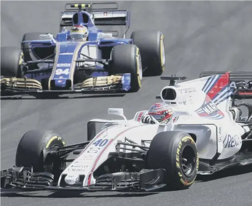  ??  ?? 0 Scotland’s Paul Di Resta, who failed to finish in his first race for three and a half years, takes a bend followed by Pascal Wehrlein.