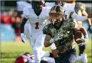  ?? DAVID C. TURBEN — FOR THE NEWS-HERALD ?? Kirtland running back Tommy Gogolin breaks a long run on Kirtland’s first drive of the game.