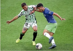  ?? GETTY IMAGES ?? Phoenix defender Liberato Cacace, here taking on Western’s Josh Risdon, has continued his excellent form.