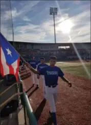  ?? PHOTO COURTESY OF ANGEL ARROYO ?? Members of Puerto Rico’s 7Baseball prepare to take the field at Avon’s Sprenger Stadium at 2009 Baseball Boulevard in the 2017 CABA High School World Series on July 6. In addition to Puerto Rico, the 17 and under tournament features 48 teams from the...