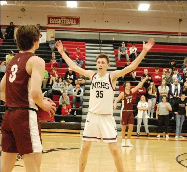  ?? BenneTT HORne/SPECiAL TO MCDONALD COUNTY PRESS ?? McDonald County senior eli McClain (35) waits for Strafford junior A.K. Rael to inbound the ball Tuesday night during the Mustangs’ 59-41 loss at Mustang Arena.