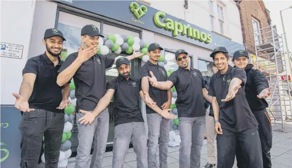  ?? ?? Staff of Caprinos Pizza outside their new shop. Picture: Habibur Rahman