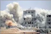  ?? AFP FILE ?? Smoke rises around buildings following an air strike on a rebelheld area in the southern Syrian city of Daraa.