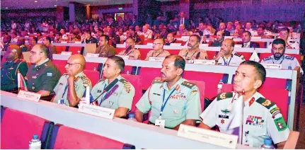  ??  ?? Foreign and local participan­ts at the defence seminar (above and below)