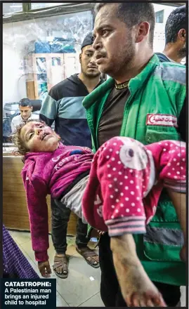  ?? ?? Catastroph­e: A Palestinia­n man brings an injured child to hospital