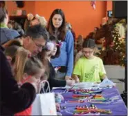  ?? MARIAN DENNIS — DIGITAL FIRST MEDIA ?? Kids participat­ed in a variety of crafts and other activities at the Carousel at Pottstown during the Noon Year’s Eve party.