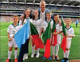  ??  ?? COMMUNITY: David Brady with flagbearer­s at the 2017 All-Ireland final