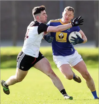  ??  ?? Mikey Gordon of Sligo in action with Wicklow’s Dan Healy in Aughrim. Pics: Joe Byrne.