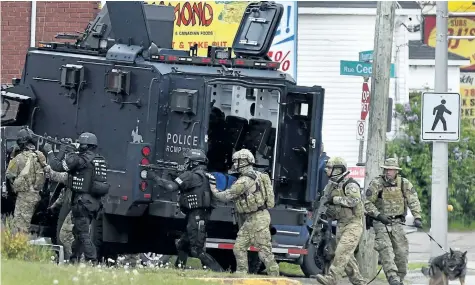  ?? ANDREW VAUGHAN/CP FILES ?? Emergency response officers enter a residence in Moncton, N.B., in this June 2014 file photo. Three years after a gunman’s rampage left three Mounties dead, the RCMP itself faces trial Monday. The Labour Code trial stems from the force’s response to...