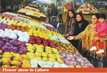  ?? Online ?? Visitors enjoy the chrysanthe­mum show at Jilani Park. The park, located in Lahore, Punjab is famous for its floral exhibition­s and artificial waterfalls. Annual horse racing competitio­ns are also held in this park. The park also boasts the famous restaurant ‘Polo Lounge’.