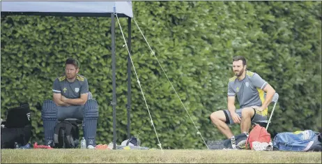  ??  ?? SOCIALLY DISTANCING
England pair Liam Dawson and James Vince wait for their practice turn at Arundel