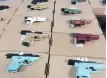  ?? PETER GOFFIN, CP ?? Toronto police display seized handguns Friday.