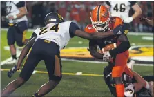  ?? OWEN MCCUE - MEDIANEWS GROUP ?? Perkiomen Valley’s Leo Hunsberger, center, is taken down by Upper Perkiomen’s Corey Jackson and Logan Simmon.