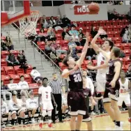  ?? MARK HUMPHREY ENTERPRISE-LEADER ?? Farmington 2019 graduate Danny Valenzuela scores going to the basket on an assist from Will Pridmore during the Cardinals victory over Huntsville (6-1) on Jan. 22, at Cardinal Arena. Valenzuela and Pridmore earned AllConfere­nce honors.