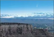  ?? THE ASSOCIATED PRESS ?? Comet Neowise soars in the horizon of the early morning sky in this view from the near the grand view lookout at the Colorado National Monument west of Grand Junction, Colo., Thursday. The newly discovered comet is streaking past Earth, providing a celestial nighttime show after buzzing the sun and expanding its tail.