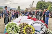  ?? — PTI ?? Relatives and locals pay last tribute to the people who were allegedly killed by the armed forces in Mon district on Monday.