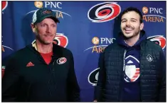  ?? AP/CHRIS SEWARD ?? Tom Dundon (left), majority owner of the NHL’s Carolina Hurricanes, and Charlie Ebersol, co-founder and CEO of the Alliance of American Football, speak with members of the media Tuesday about Dundon’s $250 million investment in the AAF.