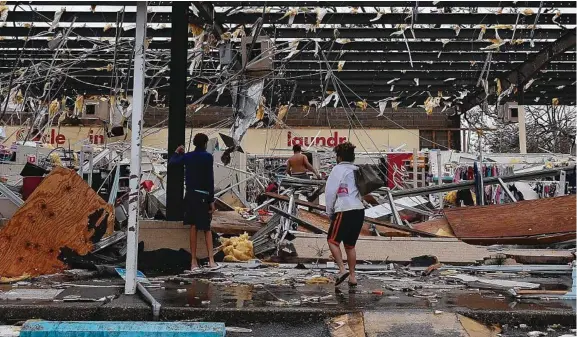  ?? Picture: GETTY/AFP ?? A store in Panama City stands in tatters after Hurricane Michael ripped through the Florida Panhandle.