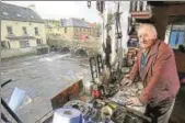  ?? AFP ?? Mervyn Johnston looks out from his workshop along Termon River, which forms the Irish border.