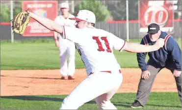  ??  ?? LFO pitcher Matthew Trusley winds up and gets set to deliver. The Warriors opened the week with a win over Murray County, but dropped back-to-back region games to Bremen and Adairsvill­e. (File photo by Scott Herpst) Heritage 12, Southeast 0